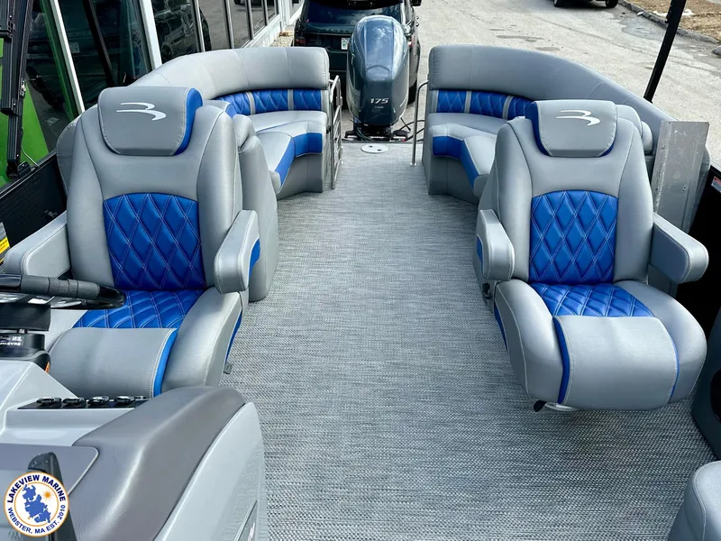 Slide: The Image of 2024 Bennington 23 LXFB pontoon boat interior with blue and gray seating. - 7