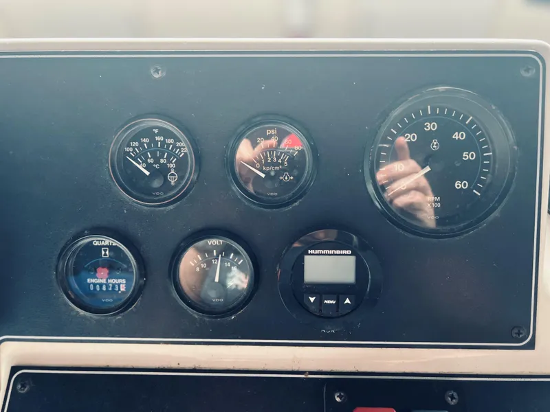 Slide: The Image of Dashboard of a 1994 Carver 350 Aft Cabin with various gauges and controls. - 14