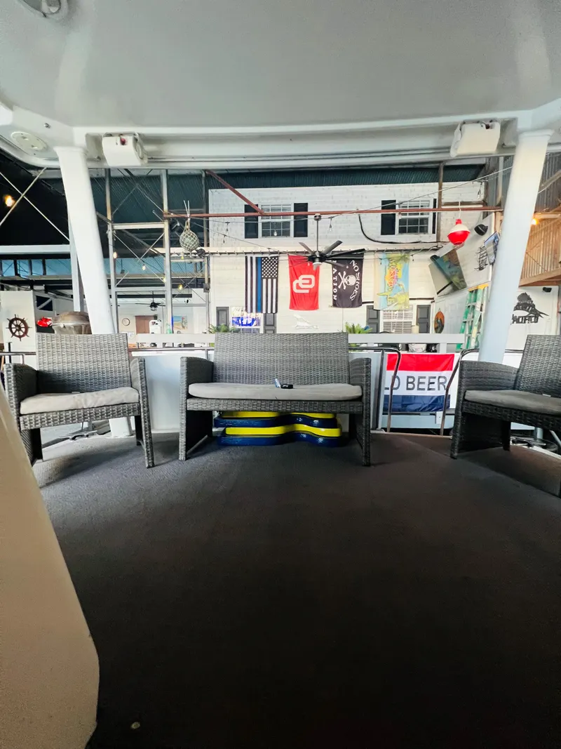 Slide: The Image of 1994 Carver 350 Aft Cabin interior with wicker chairs and nautical decor. - 18