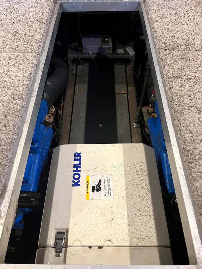 Slide: The Image of Engine compartment of a 1994 Carver 350 Aft Cabin with Kohler generator. - 26