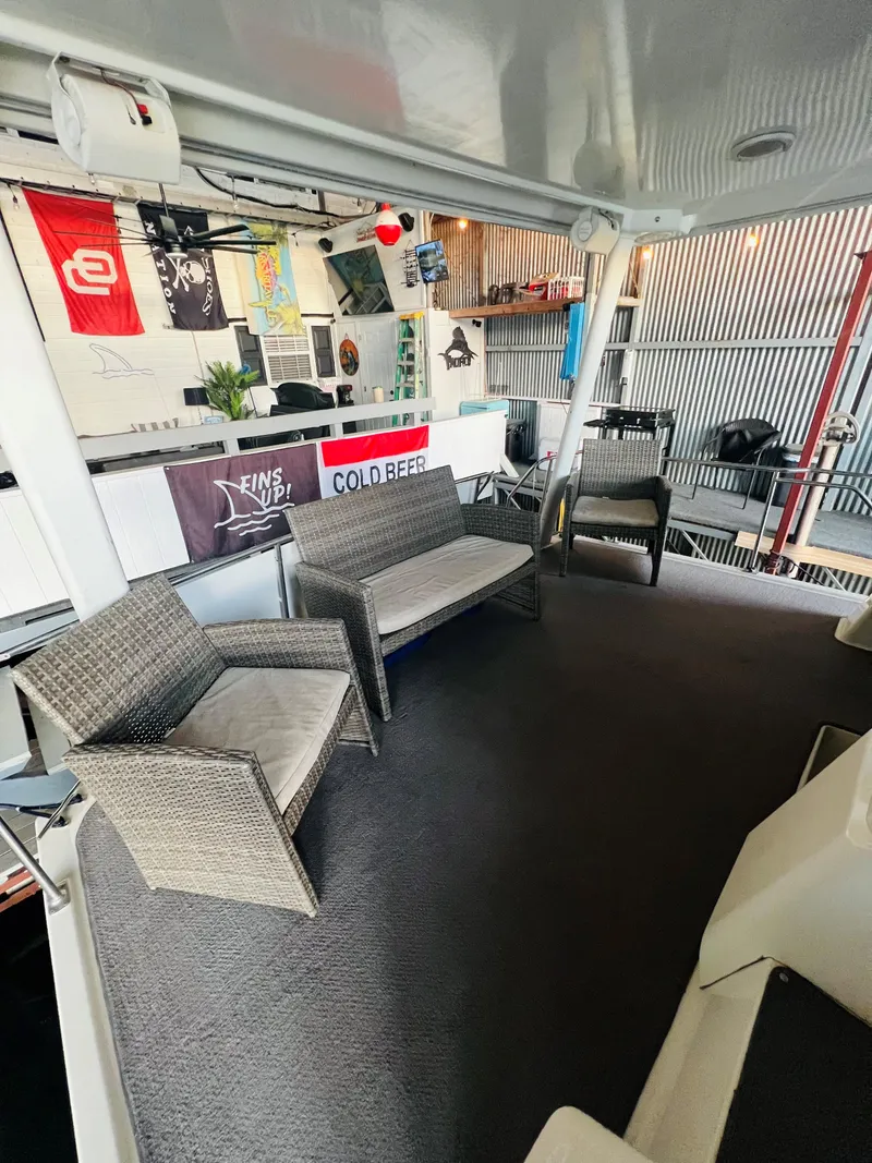 Slide: The Image of 1994 Carver 350 Aft Cabin interior with wicker seating and nautical decor. - 19