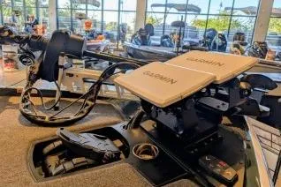 Slide: The Image of 2025 Ranger Z520 boat with Garmin electronics in a showroom setting. - 2