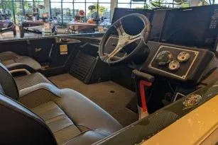 Slide: The Image of 2025 Ranger Z520 boat interior with steering wheel and dashboard controls. - 3