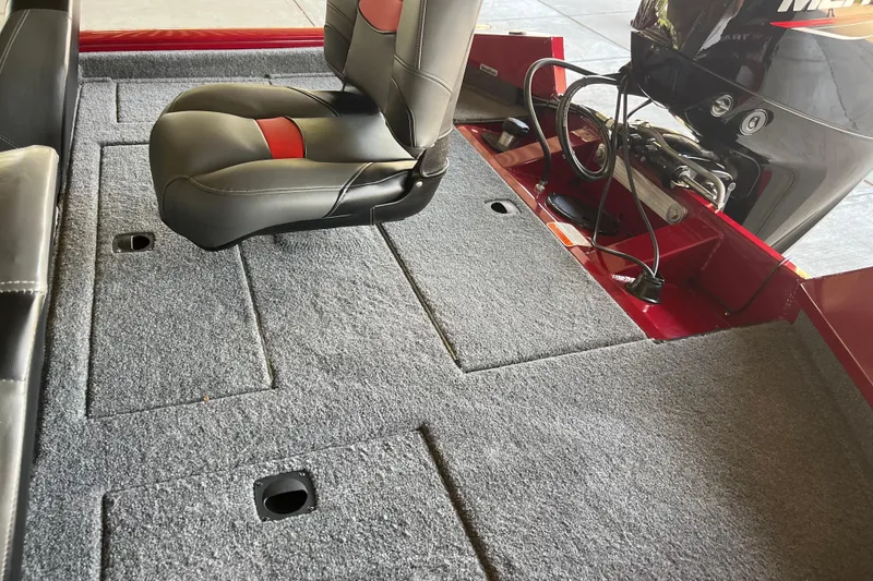 Slide: The Image of 2025 Tracker Pro Team 190 boat interior with carpeted deck and seating. - 3