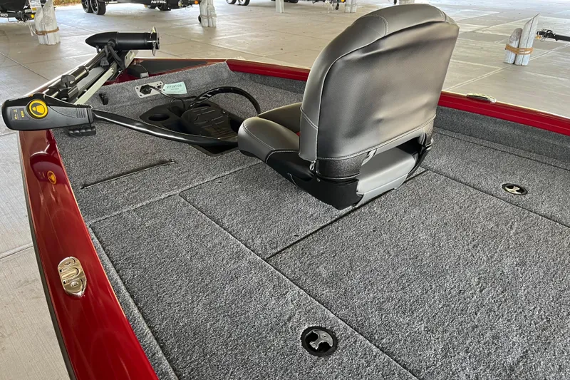 Slide: The Image of 2025 Tracker Pro Team 190 boat interior with gray carpet and seating. - 5