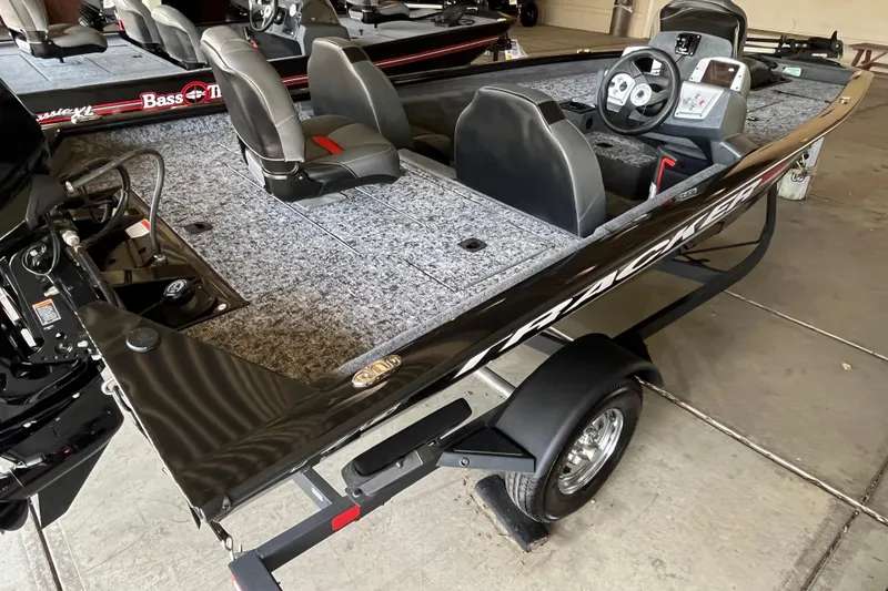 Slide: The Image of 2025 Tracker Pro Team 175 boat with dual seats and steering console. - 2