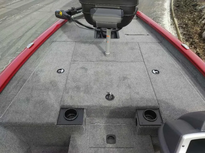 Slide: The Image of 2025 Tracker Pro Team 175 boat interior with gray carpet and red trim. - 4