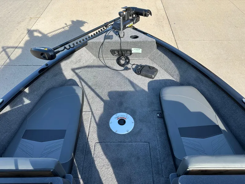 Slide: The Image of 2025 Tracker Pro Guide V-175 Combo boat interior with seating and trolling motor. - 3