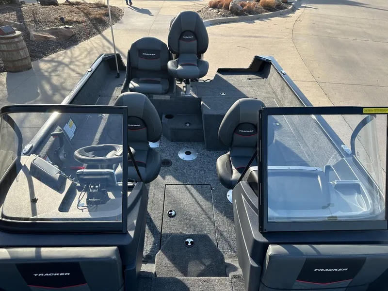 Slide: The Image of 2025 Tracker Pro Guide V-175 Combo boat interior with seating and steering console. - 6