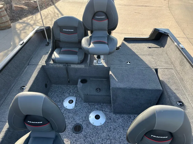 Slide: The Image of 2025 Tracker Pro Guide V-175 Combo boat interior with four seats and carpeted flooring. - 7