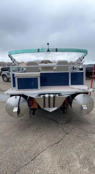 Slide: The Image of 2022 Forester 2208CC pontoon boat, rear view, parked on pavement. - 3