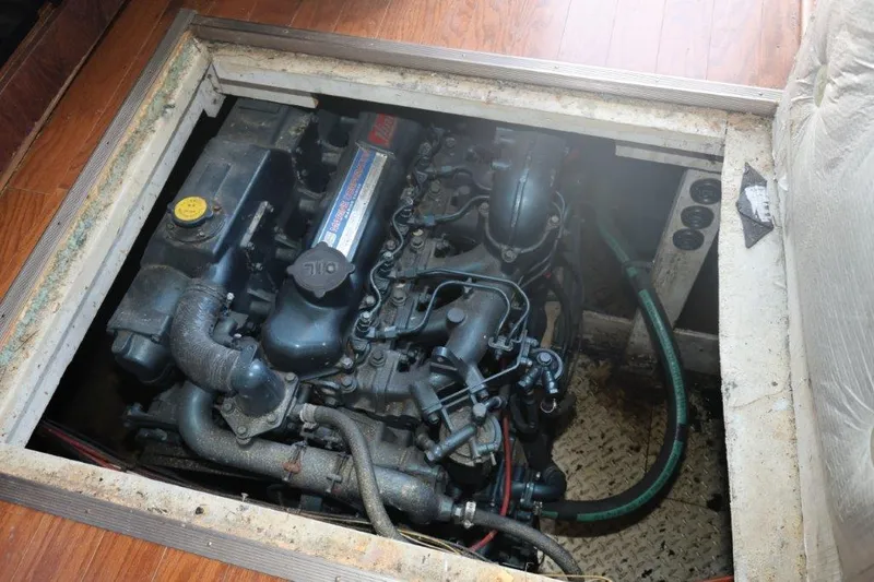 Slide: The Image of Engine compartment of 1988 Bayliner 3888 MY Sedan with visible mechanical components. - 10