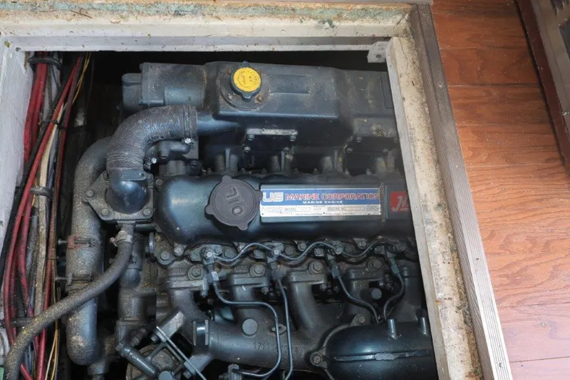 Slide: The Image of Engine compartment of 1988 Bayliner 3888 MY Sedan boat, showing detailed mechanical components. - 11