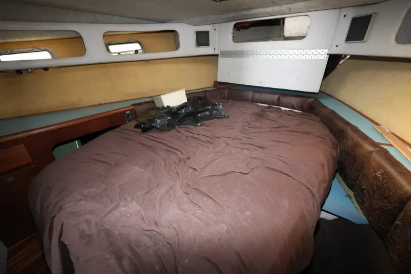 Slide: The Image of Interior cabin of 1988 Bayliner 3888 MY Sedan with cozy bed setup. - 13