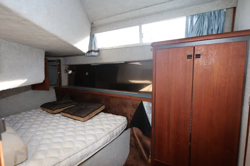 Slide: The Image of Interior cabin of 1988 Bayliner 3888 MY Sedan with bed and wooden wardrobe. - 17
