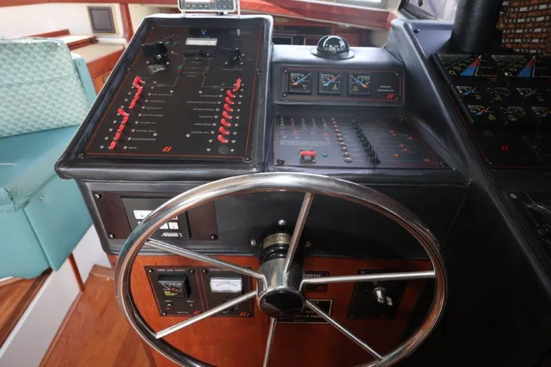 Slide: The Image of Control panel of 1988 Bayliner 3888 MY Sedan with steering wheel and gauges. - 8