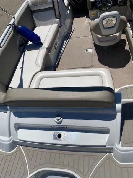 Slide: The Image of 2019 Crownline E 205 XS boat interior with seating and steering wheel. - 6