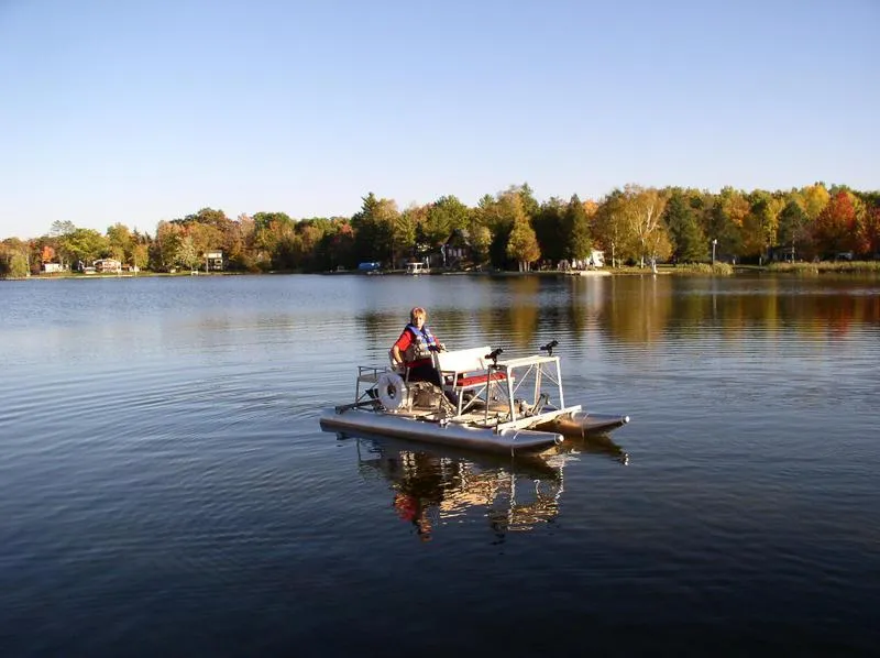 Slide: The Image of Person on Aqua Cycle AC4x4W pedal boat on a calm lake, 2024 model. - 8