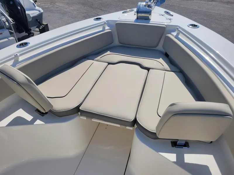 Slide: The Image of 2025 Key West 239 FSR boat interior with cushioned seating. - 10