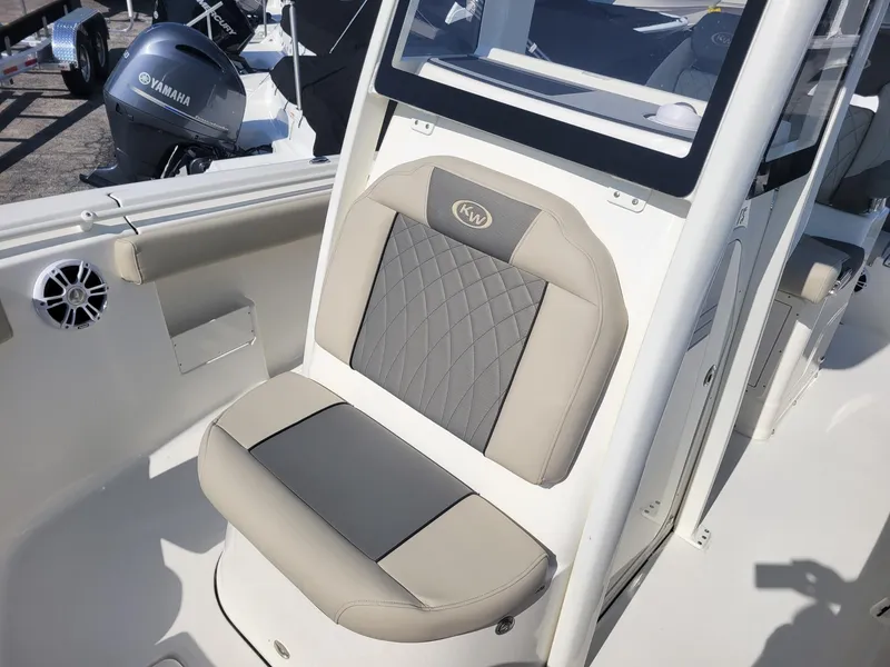 Slide: The Image of 2025 Key West 239 FSR boat seat with gray and beige upholstery. - 11