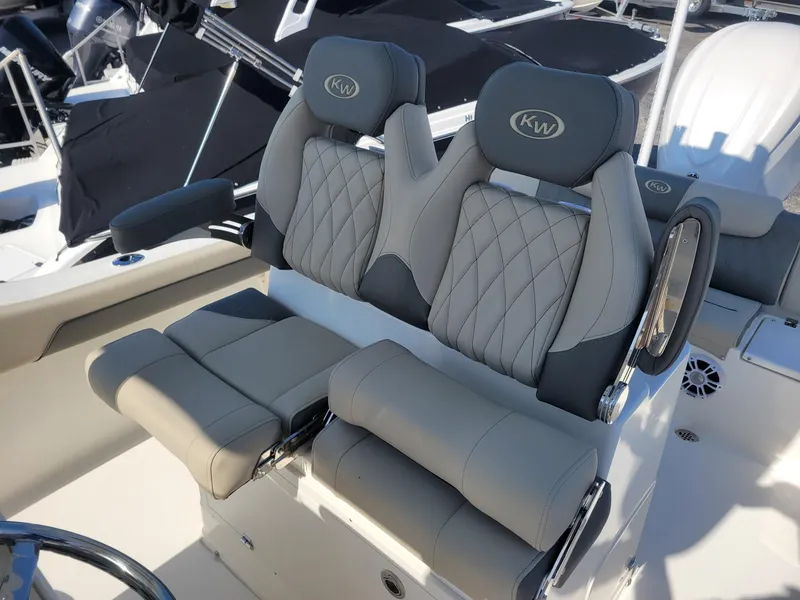 Slide: The Image of 2025 Key West 239 FSR boat seats with quilted design and armrests. - 12