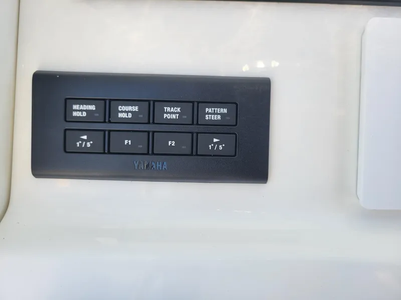 Slide: The Image of Control panel of a 2025 Key West 239 FSR boat with Yamaha features. - 16
