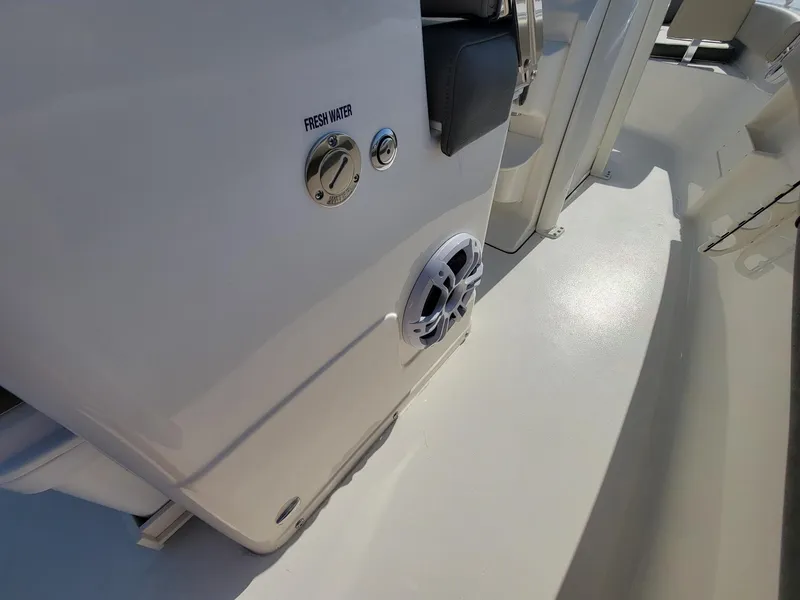 Slide: The Image of 2025 Key West 239 FSR boat interior with fresh water access and speaker. - 18