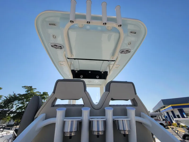 Slide: The Image of 2025 Key West 239 FSR boat interior with rod holders and overhead console. - 20