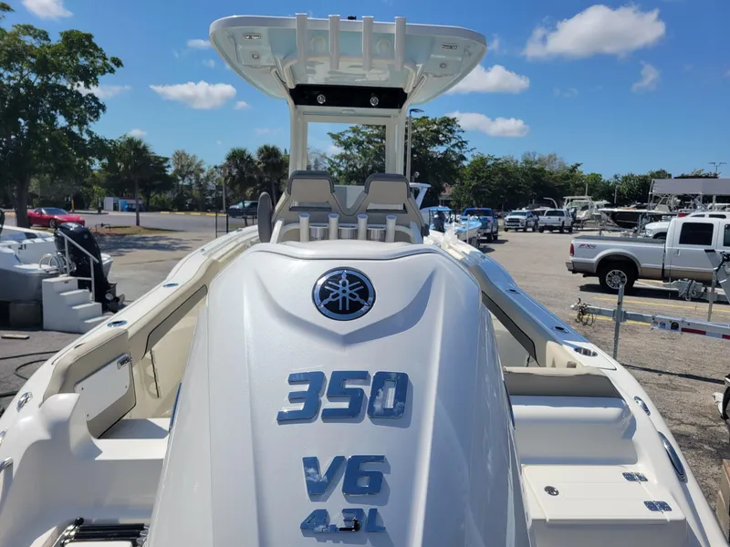Slide: The Image of 2025 Key West 239 FSR boat with Yamaha 350 V6 engine, parked outdoors. - 3