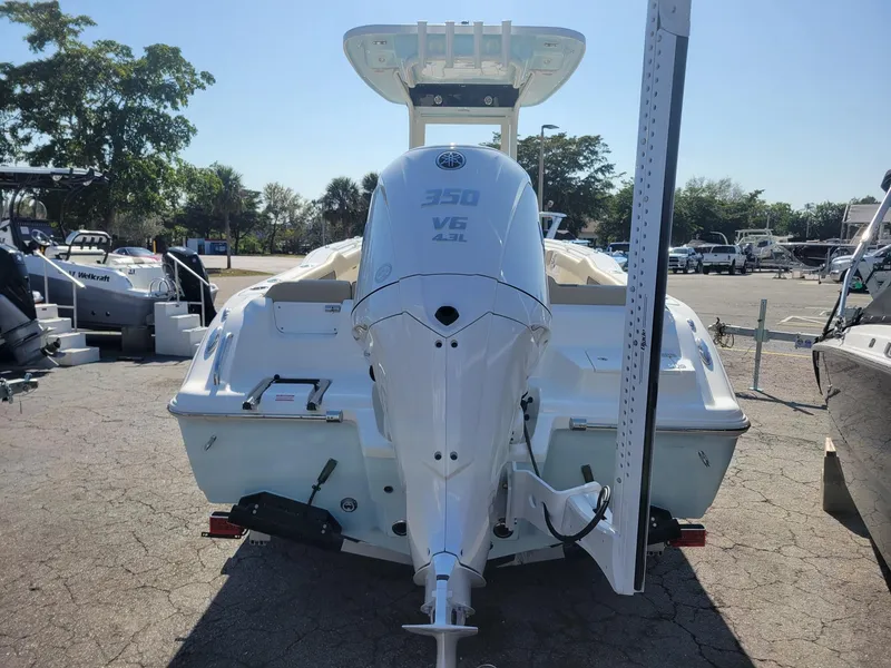 Slide: The Image of 2025 Key West 239 FSR boat with powerful V6 engine, parked outdoors. - 5