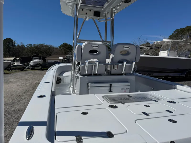 Slide: The Image of 2025 Contender 26 Bay boat interior with dual seats and storage compartments. - 17