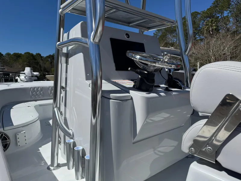 Slide: The Image of 2025 Contender 26 Bay boat interior with sleek console and chrome details. - 23