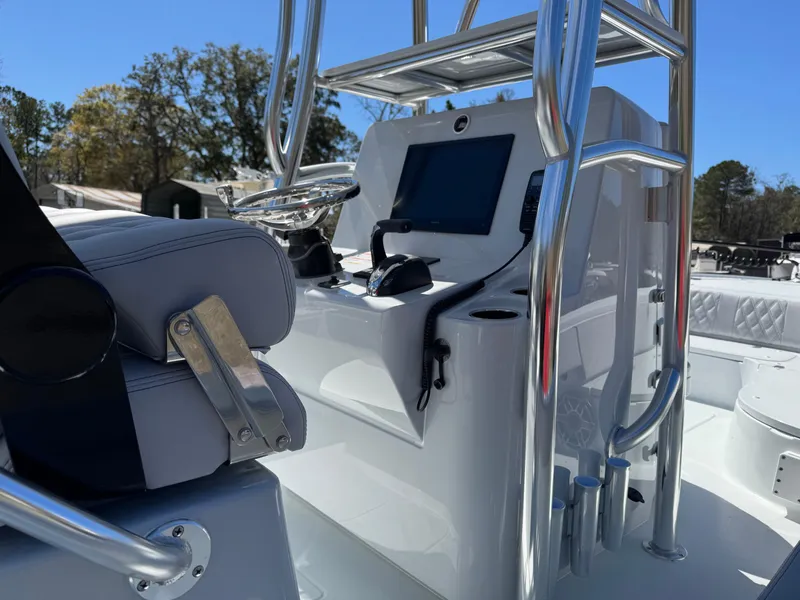 Slide: The Image of 2025 Contender 26 Bay boat console with modern controls and seating. - 8
