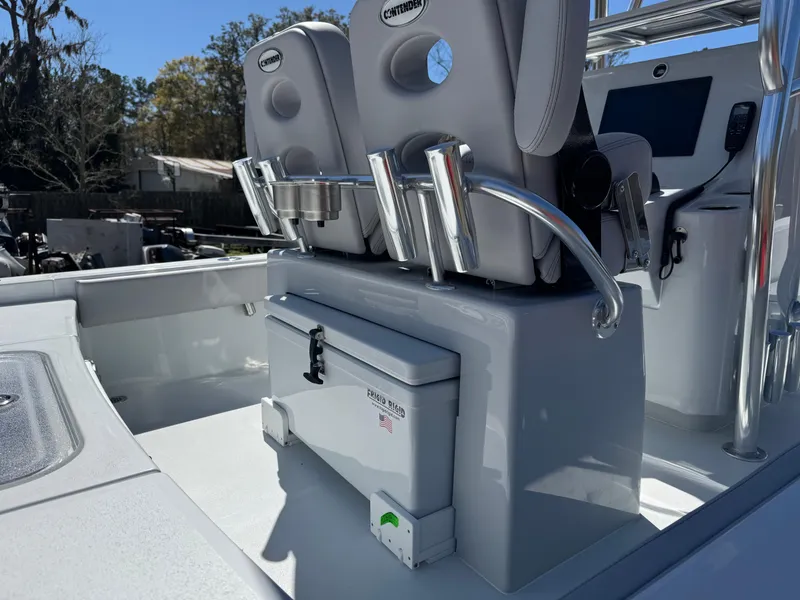 Slide: The Image of 2025 Contender 26 Bay boat interior with seating and storage features. - 9