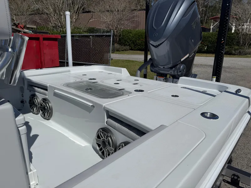 Slide: The Image of 2025 Contender 26 Bay boat interior with speakers and motor, showcasing modern design. - 16