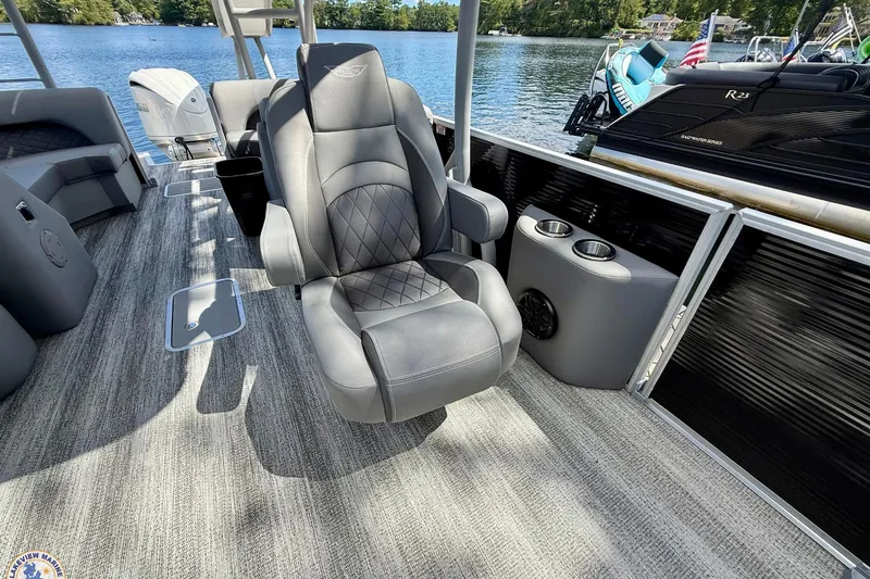 Slide: The Image of 2025 Bennington 26 LSRTD boat interior with luxurious seating and lake view. - 10
