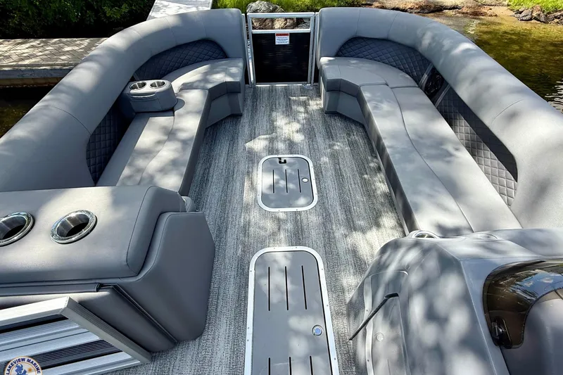 Slide: The Image of 2025 Bennington 26 LSRTD pontoon boat with spacious seating and modern design. - 5