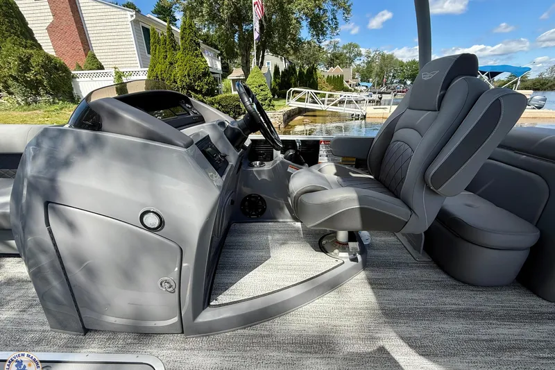 Slide: The Image of Interior of 2025 Bennington 26 LSRTD boat with sleek gray captain's chair and console. - 9