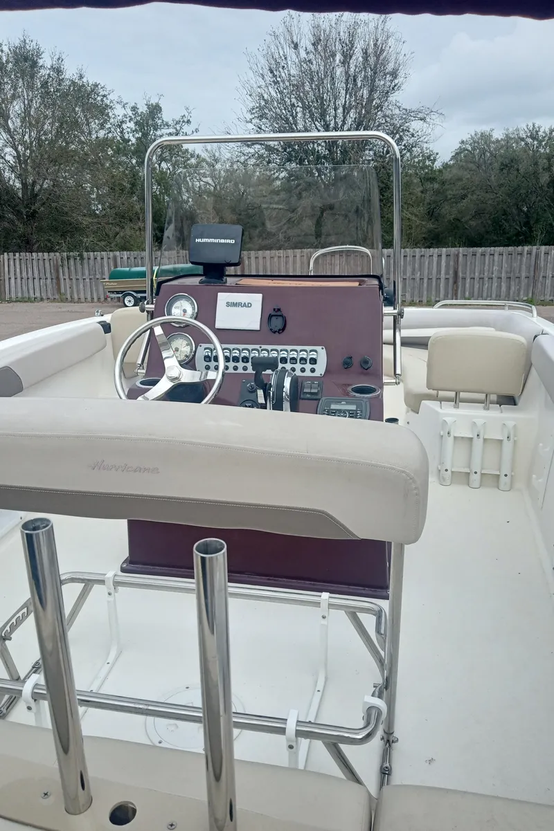 Slide: The Image of 2017 Hurricane CC19 boat interior with steering console and seating. - 3