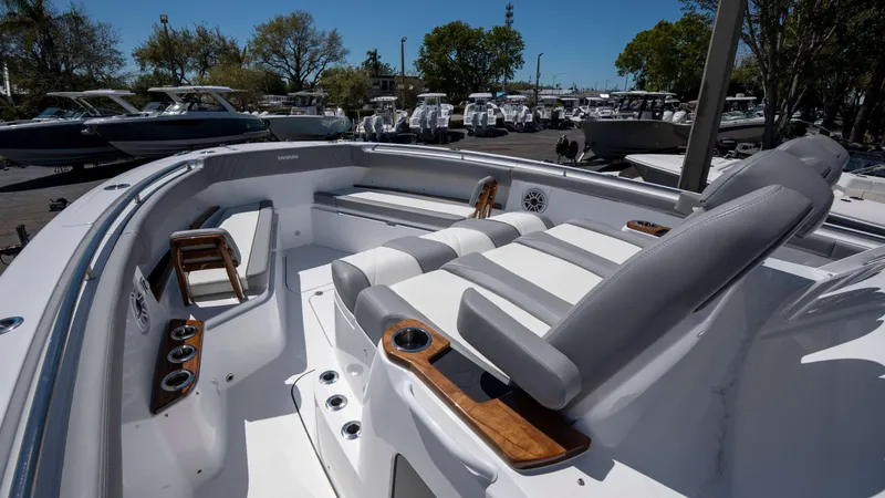 Slide: The Image of 2025 Everglades 455 CC boat interior with luxurious seating and cup holders. - 10