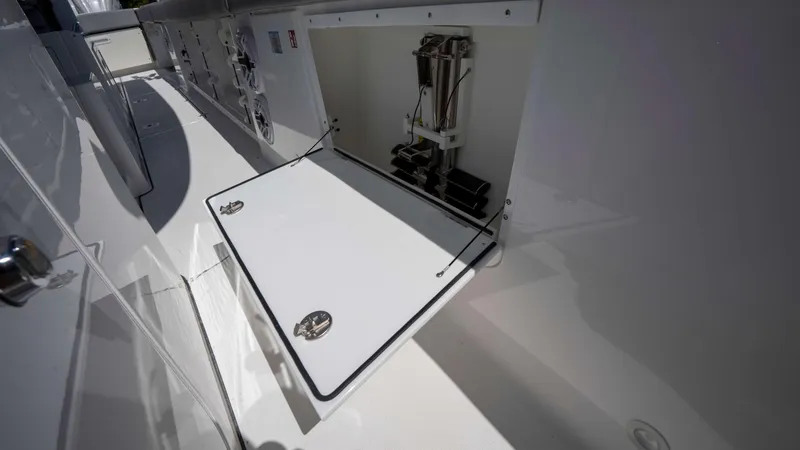 Slide: The Image of Open storage compartment on 2025 Everglades 455 CC boat, showcasing interior details. - 17