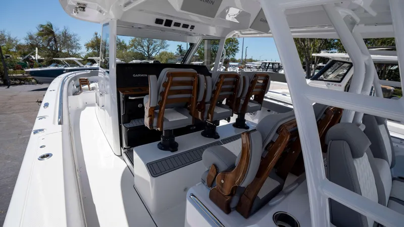 Slide: The Image of 2025 Everglades 455 CC boat interior with seating and helm station. - 5
