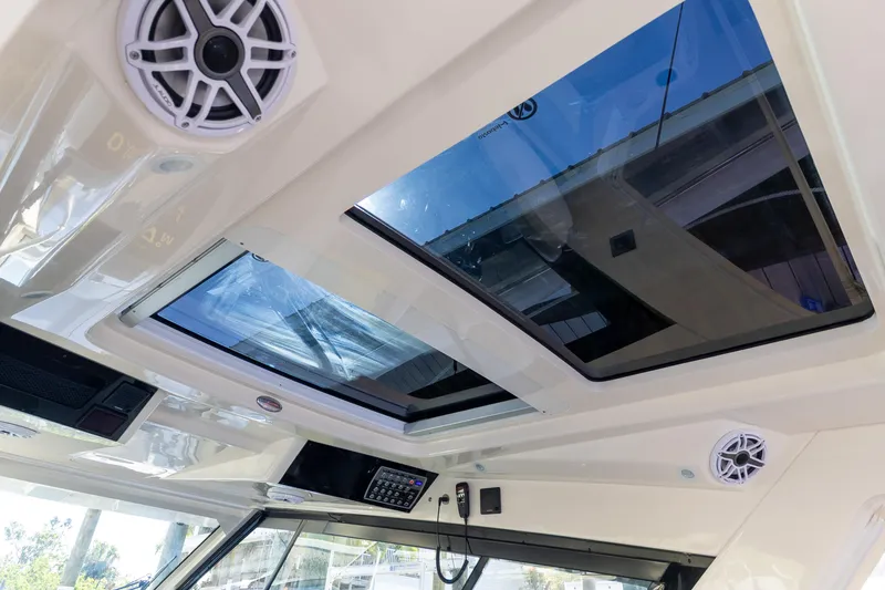 Slide: The Image of 2020 Scout 530LXF boat interior with skylights and speakers. - 15