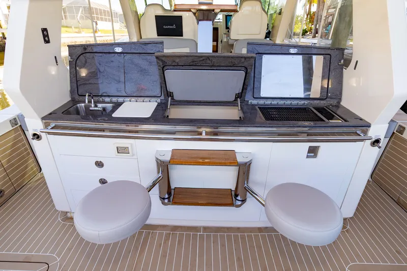 Slide: The Image of 2020 Scout 530LXF yacht interior with modern kitchen amenities and seating. - 19