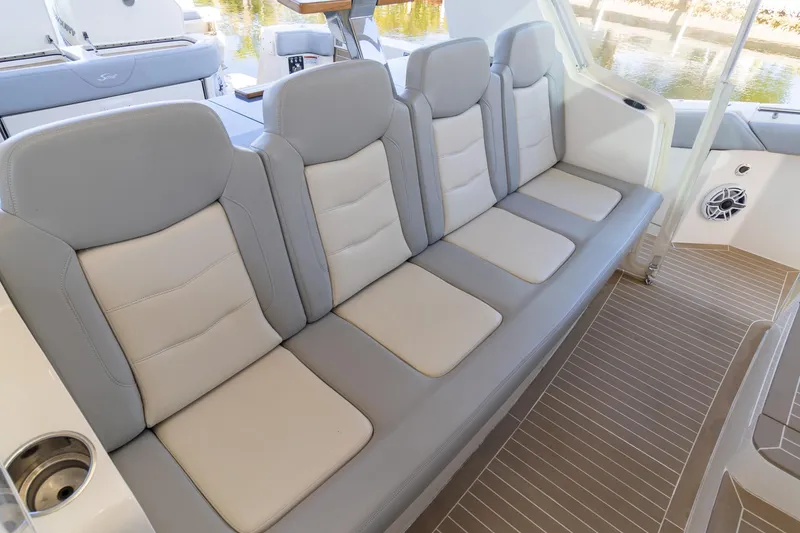 Slide: The Image of 2020 Scout 530LXF boat interior with luxurious gray seating and modern design. - 25