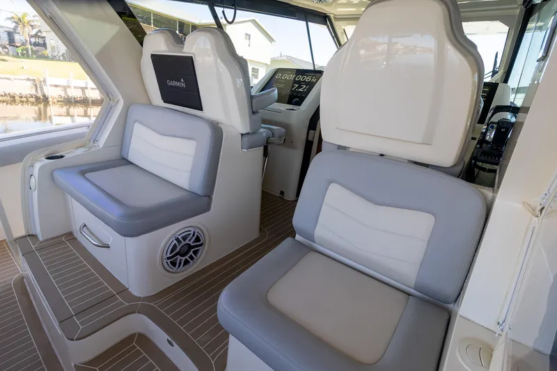 Slide: The Image of 2020 Scout 530LXF boat interior with cushioned seating and modern design. - 26