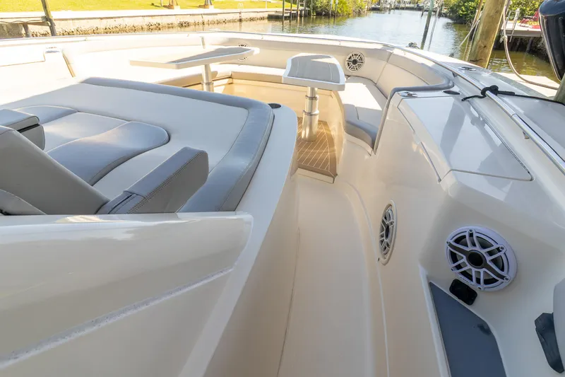 Slide: The Image of 2020 Scout 530LXF boat interior with seating and table, showcasing luxury design. - 29