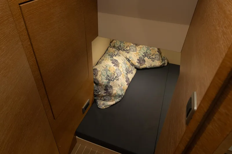 Slide: The Image of 2020 Scout 530LXF cabin interior with cozy bedding and wooden finish. - 36