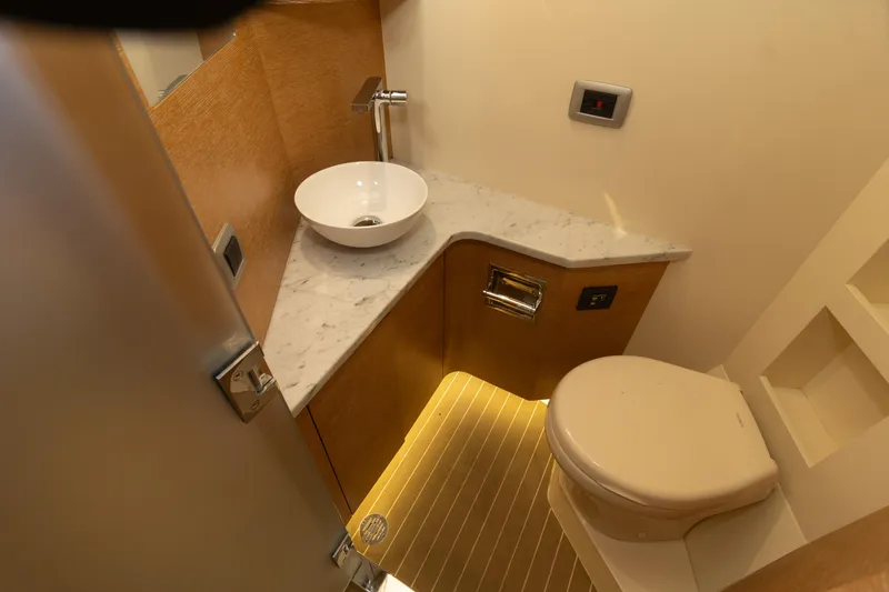 Slide: The Image of Luxurious bathroom in 2020 Scout 530LXF boat with modern fixtures and marble countertop. - 38