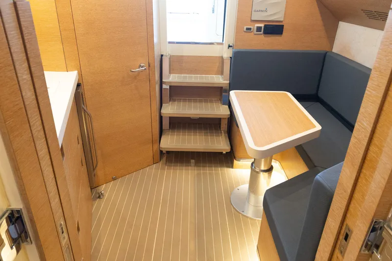 Slide: The Image of 2020 Scout 530LXF interior with wooden flooring, compact dining area, and modern design. - 41